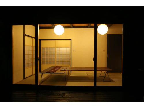 a view of a room with a table and two lights at Kishida House - Vacation STAY 36613v in Nagahama