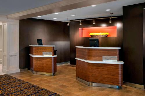a lobby of a hotel with a reception desk at Sonesta Select Boston Danvers in Danvers