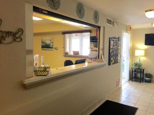 a mirror on the wall of a salon at Sonesta Simply Suites Denver West Federal Center in Lakewood