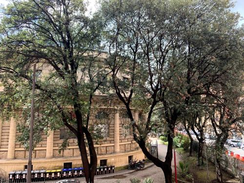 a building with a bunch of trees in front of it at Paramount in Rome