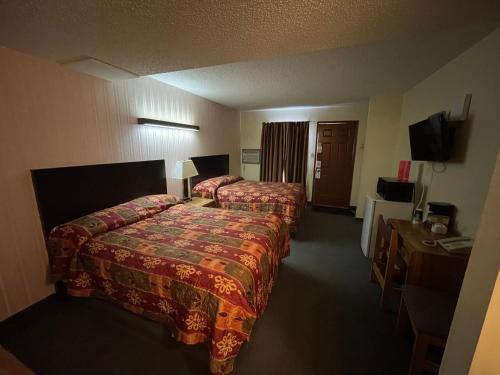 Postel nebo postele na pokoji v ubytování Circle 6 Motel