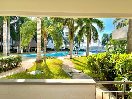 Bazén v ubytování COSTA VELEROS MARINA MAZATLAN 101 nebo v jeho okolí