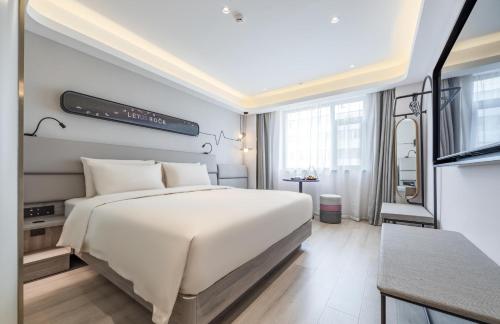Giường trong phòng chung tại Atour Light Hotel Lanzhou Yantan RT-Mart