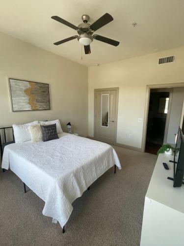 a bedroom with a bed with a ceiling fan at 2bedroom 1Bath 10 mins to Texas Medical in Houston