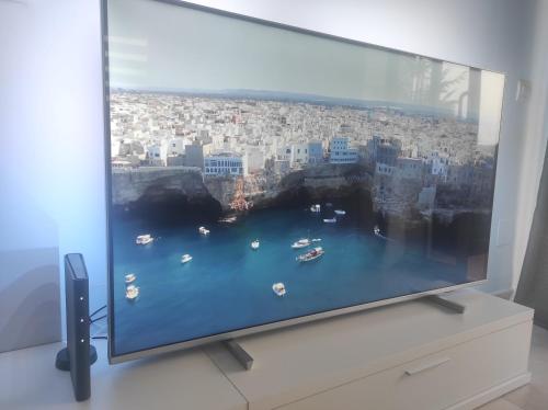 a flat screen tv sitting on top of a table at Paradise Village Port Aventuras in Salou