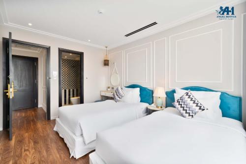 Angel Hotels Beach Danangにあるベッド