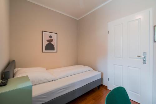 Postel nebo postele na pokoji v ubytování SUITE & APART