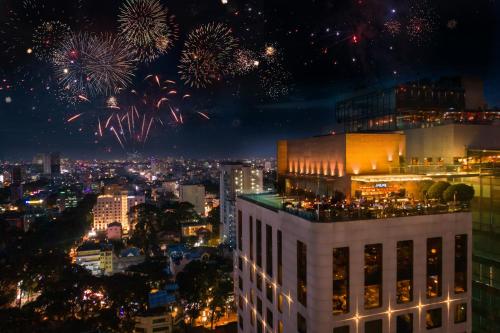 a view of a city with fireworks in the sky at Hotel Des Arts Saigon Mgallery Collection in Ho Chi Minh City