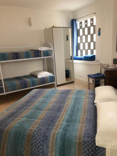 a bedroom with two bunk beds and a mirror at Joy Living in Sandra