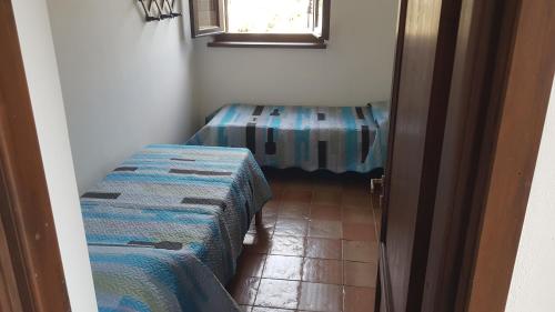 Postel nebo postele na pokoji v ubytování Case La Pergola