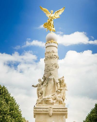 a statue of an angel on top of a tower at Best view, pool and spa on the Champagne vineyard in Saint-Thierry