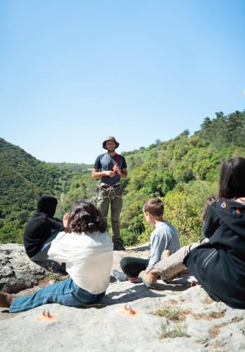 a group of people sitting on top of a mountain at The Riders' Experience - Glamping and Attractions Park- Full Board in Bet Oren