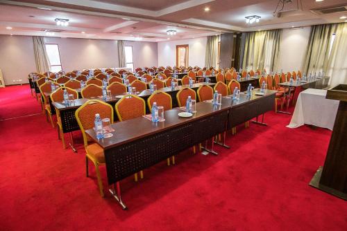 a conference room with a long table and chairs at Ngong Hills Hotel in Nairobi