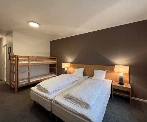 En eller flere senge i et værelse på Møn Golf Resort - Hotel Præstekilde
