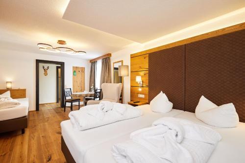 Uma cama ou camas num quarto em Hotel Rupertihof