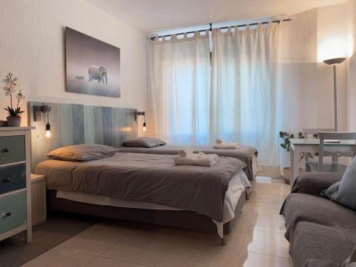 Кровать или кровати в номере Apartamentos RG Resitur