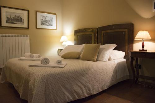 Posteľ alebo postele v izbe v ubytovaní Agriturismo Scuderie della Contea