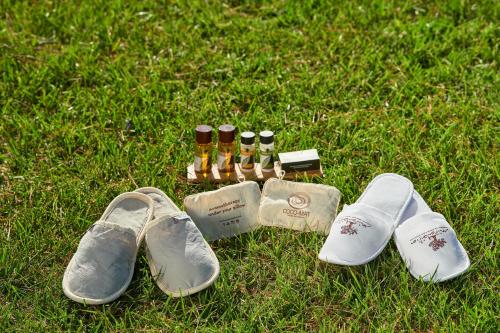 a group of shoes and a group of bottles of wine at Mirabilia Boutique Hotel in Kriopigi