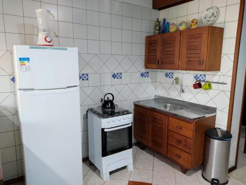 Kuchyň nebo kuchyňský kout v ubytování Pousada Capricórnio