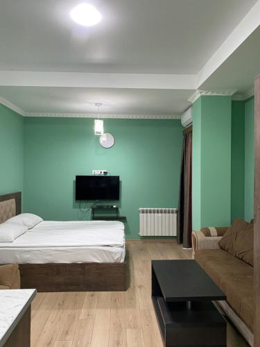 Ένα ή περισσότερα κρεβάτια σε δωμάτιο στο Happy Stay