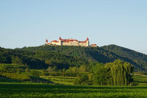 a house on the top of a hill at Gästehaus Benediktinerstift Göttweig - Bed & Breakfast Monastery in Furth