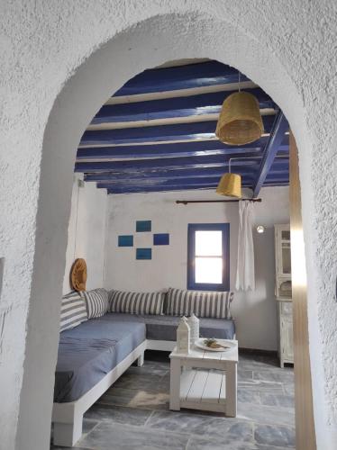 a living room with a couch and a table at Malli Sea House in Mamádhos