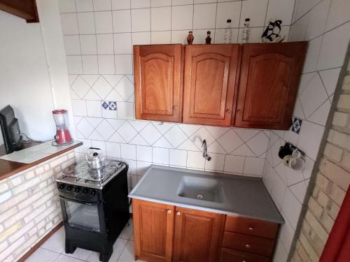 Kuchyň nebo kuchyňský kout v ubytování Pousada Capricórnio