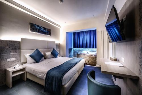 Posteľ alebo postele v izbe v ubytovaní Suite Blue Style