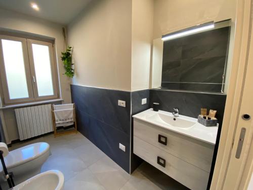 a bathroom with a sink and a toilet at Relaxing Home in Tignale