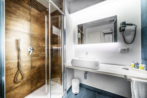 a bathroom with a shower and a sink at Suite Blue Style in Rome