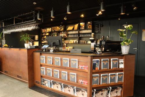 a bar with a counter with books on it at Comfort Hotel Xpress Stockholm Central in Stockholm