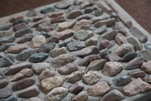 a bunch of rocks on top of a table at Olive Ala-Archa Hotel & SPA in Verkhnyaya Alaarcha
