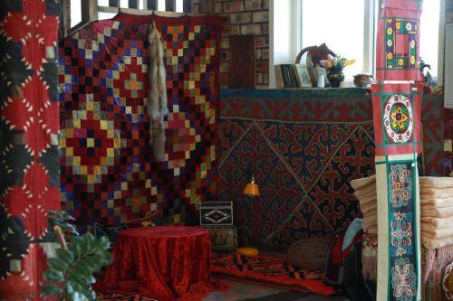 a room with a table and a patterned wall at Olive Ala-Archa Hotel & SPA in Verkhnyaya Alaarcha