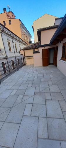an empty parking lot in front of some buildings at La Terrazza del Quarto in LʼAquila