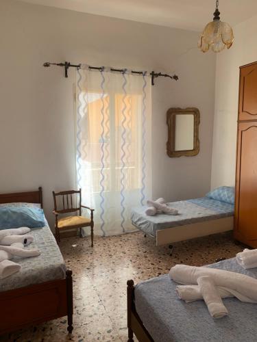 Katil atau katil-katil dalam bilik di Lampedusa House
