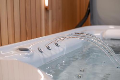 a stream of water coming out of a sink at Giesserei in Arbon