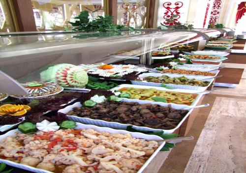a buffet line with many different types of food at MİRA RESORT & Spa - All Inclusive in Kemer