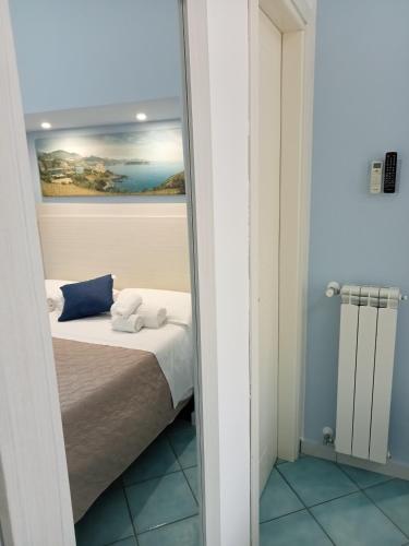 a reflection of a bed in a mirror at Borgo 800 in San Nicola Arcella