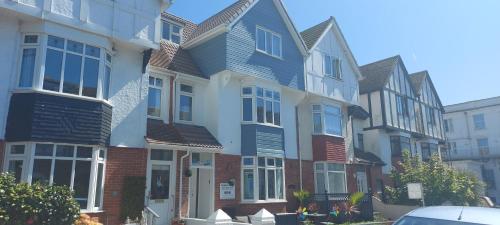 a row of houses on a city street at Trentham House in Paignton