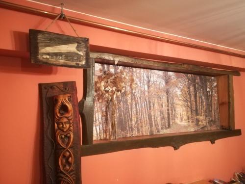 a window in a room with a painting on the wall at Noclegi Kamionka in Cisna