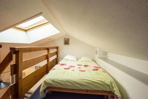 מיטה או מיטות בחדר ב-Appartement a 900m de la plage aux Sables d'Olonne
