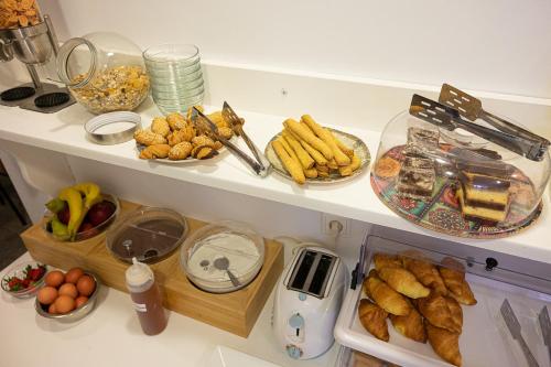 a shelf with a bunch of food on it at Dionysos Hotel in Poros