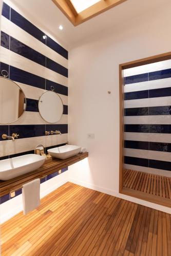 a bathroom with a sink and a mirror at Lampara Mare in Vico Equense