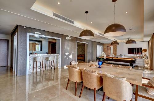 a kitchen and dining room with a large table and chairs at Royalton Saint Lucia, An Autograph Collection All-Inclusive Resort in Gros Islet