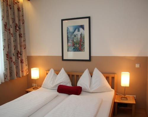 Posteľ alebo postele v izbe v ubytovaní Hotel Pension Alte Mühle