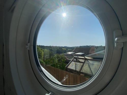 a round window with a view of a skate park at The Pod in Kingsbridge