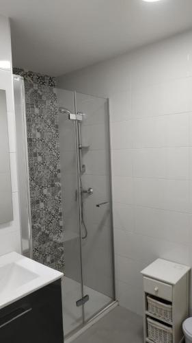 a bathroom with a shower with a glass door at El Paraiso in Aguadulce