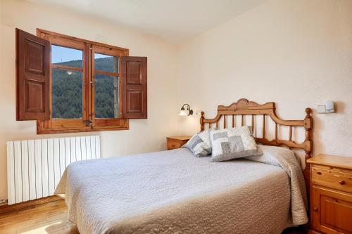 Säng eller sängar i ett rum på Cal Mestre