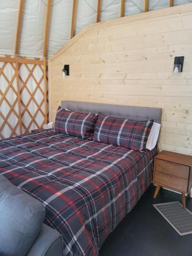 a bed in a room in a yurt at Maggie Valley Cabin Rentals in Maggie Valley