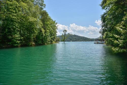 a large lake with trees on the side of it at The Dawg Pound in Maynardville